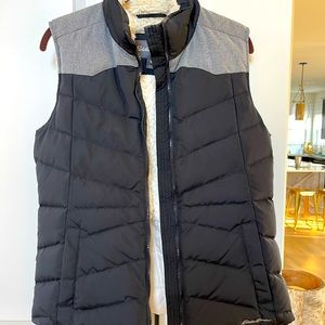 Womens down insulated black and gray vest.